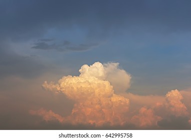 Orange and red light on clouds with overcast sky