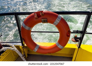 Orange Rescue Ring On A Ferry Boat In Lisbon