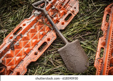 Orange Rescue Sand Tracks And Shovel On Grass - Offroad Recovery Equipment.