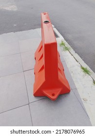 The Orange Road Barrier Or Road Water Barrier Located On The Side Of The Road Is Open. 


