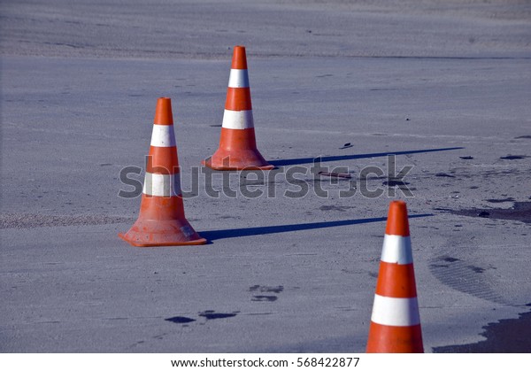 Orange road hazard
cone on accident site 