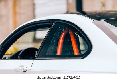 Orange Roll Cage In The Back Of A Coupe Sports Car