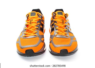 Orange Running Shoes, Isolated On White.