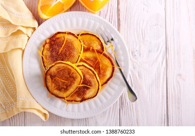 Orange Scotch Pancakes Served On Plate On Table