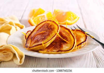 Orange Scotch Pancakes Served On Plate On Table