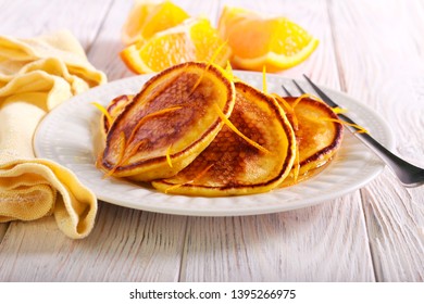 Orange Scotch Pancakes Served On Plate On Table