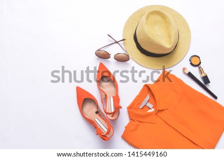 Orange ,shoes, clothes, cosmetics and accessories. Flat lay,

