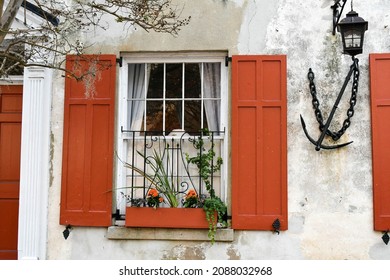 Orange Shutters On A House In Charleston, SC