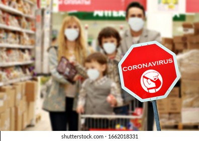 Orange sign warning of pandemic due to Covid-19 or corona virus in supermarket with in purposely blurred background caucasian family wearing protective hygienic masks - Powered by Shutterstock