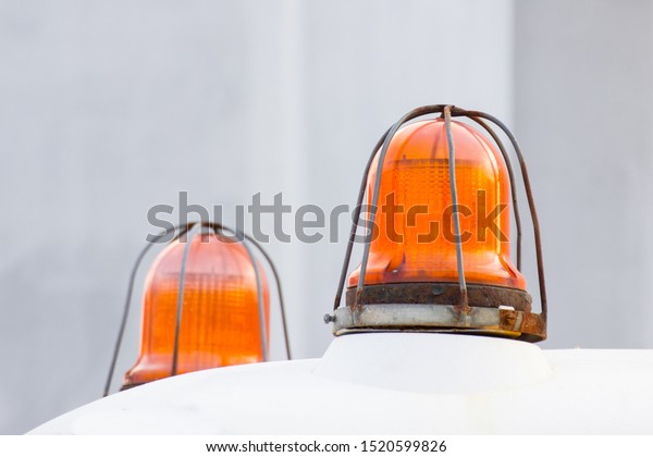 Orange siren signal lamp for warning. Flashing\
light on vehicle