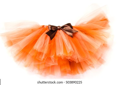 Orange skirt tutu with brown bow on a white background