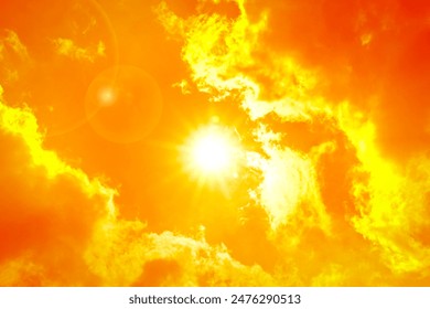 Orange sky with sun and clouds during hot summer weather