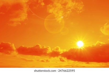 Orange sky with sun and clouds during hot summer weather