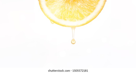 Orange Slice Dripping Juice On White Background