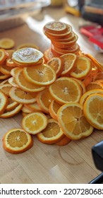 Orange Slices From Mandolin And On Butcher Block Cutting Board