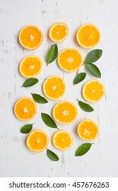 Orange Slices On White Rustic Wooden Background, Top View, Flat Lay, Summer And Healthy Concept