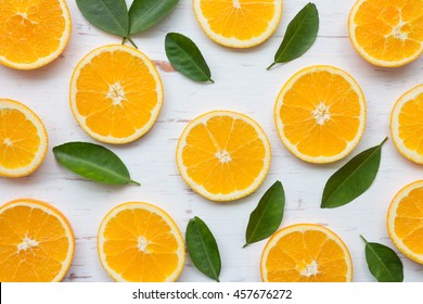 Orange Slices On White Rustic Wooden Background, Top View, Flat Lay, Summer And Healthy Concept