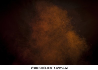 Orange Smoke In A Dark Room. Texture, Background 