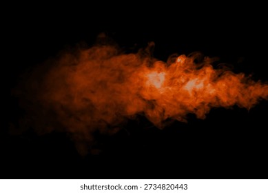 Orange smoke effect floating on black background. Abstract bright and intense background. Fog or smoke.