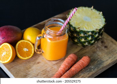 Orange Smoothie With Carrots, Mango,coconut Water And Pineapple