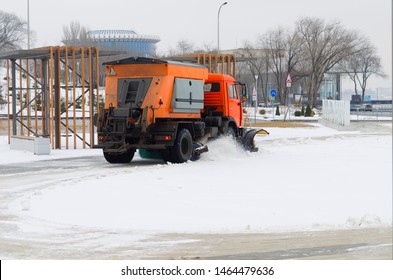 Orange Snow Plow Cleans Snow From The Public Utilities