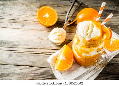 Orange Soda Creamsicle cocktail. Ice Cream and orange smoothie. Dreamsicle drink. Rustic wooden background copy space