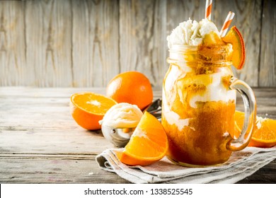 Orange Soda Creamsicle cocktail. Ice Cream and orange smoothie. Dreamsicle drink. Rustic wooden background copy space