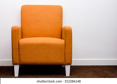 Orange Sofa Furniture On White Wall Background