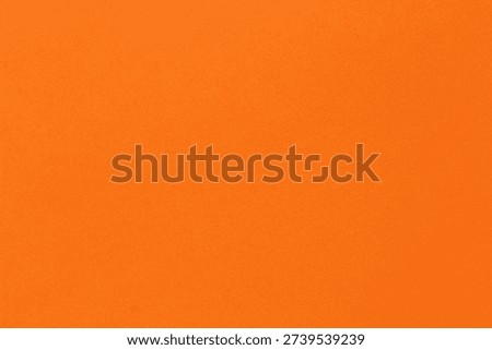 Orange solid color texture background with subtle grain surface