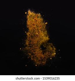 Orange spices powder explosion, flying pepper on black background. Freeze motion photo - Shutterstock ID 1539016235