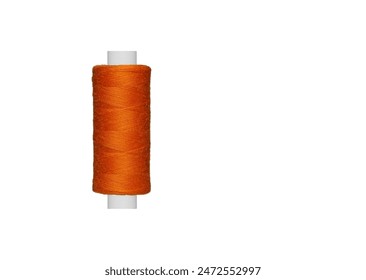 orange spool of sewing thread isolated on white background close up - Powered by Shutterstock