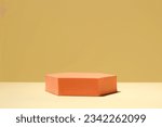 Orange stand on table against yellow background, space for text. Stylish presentation for product