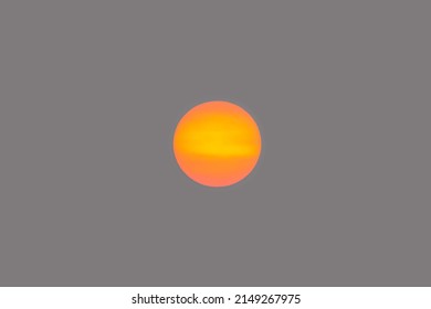 Orange Sun Disk Isolated On Smoky Sky