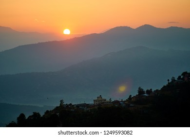 Orange sunrise above mountain in valley Himalayas mountains