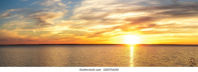 Orange sunset sky. sky for background or sunrise and cloud at morning. Dramatic sunset sky with clouds. Dramatic sunset over sea. Image of cloud sky on evening time. - Shutterstock ID 2203756245