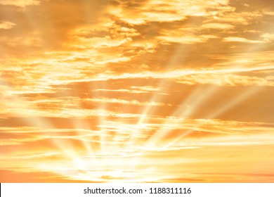 Orange Sunset Sky With Sun Rays And Clouds For Nature Background