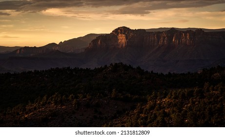 Orange Sunset In The Southwestern United States With Mountains And Trees