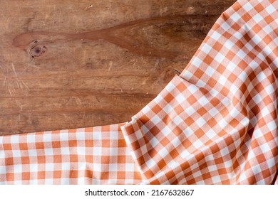 Orange Table Cloth On Wooden Background 