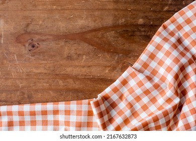 Orange Table Cloth On Wooden Background 