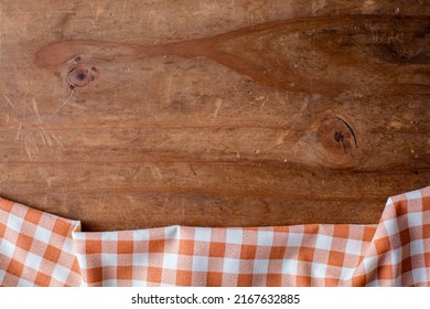 Orange Table Cloth On Wooden Background 