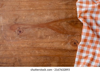 Orange Table Cloth On Wooden Background 