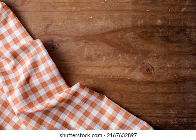 Orange Table Cloth On Wooden Background 