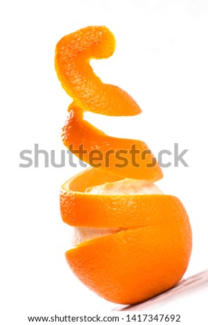 orange taken in a creative pealing pattern 