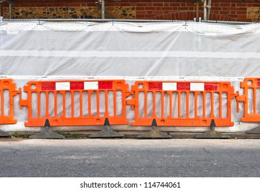 Orange Temporary Boundary Fencing At A Construction Site