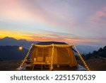 Orange tent in camping area in top at Tak, North of Thailand in winter season, Laandscape view point in travel point near Chiang mai, Thailand