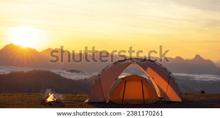 Orange tent in camping area in top at Tak, North of Thailand in winter season, Laandscape view point in travel point near Chiang mai, Thailand