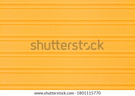 Orange textured cardstock paper closeup background with copy space for message or use as a texture 