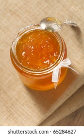 Orange Thin Cut Marmalade Or Jam  In A Jar With  A Spoon, Shallow DOF