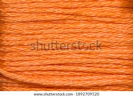 orange threads for embroidery in magnification