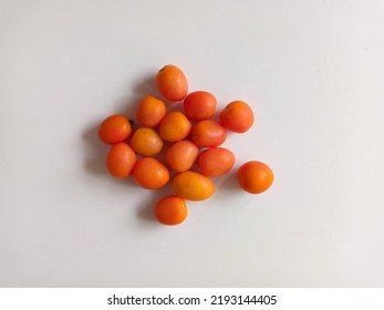 Orange Tomatoes Isolated In White Background.